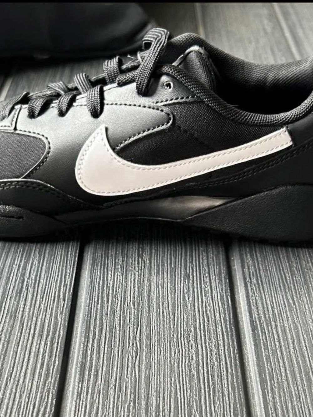 women’s lifestyle Nike Black Sneaker with White Swoosh